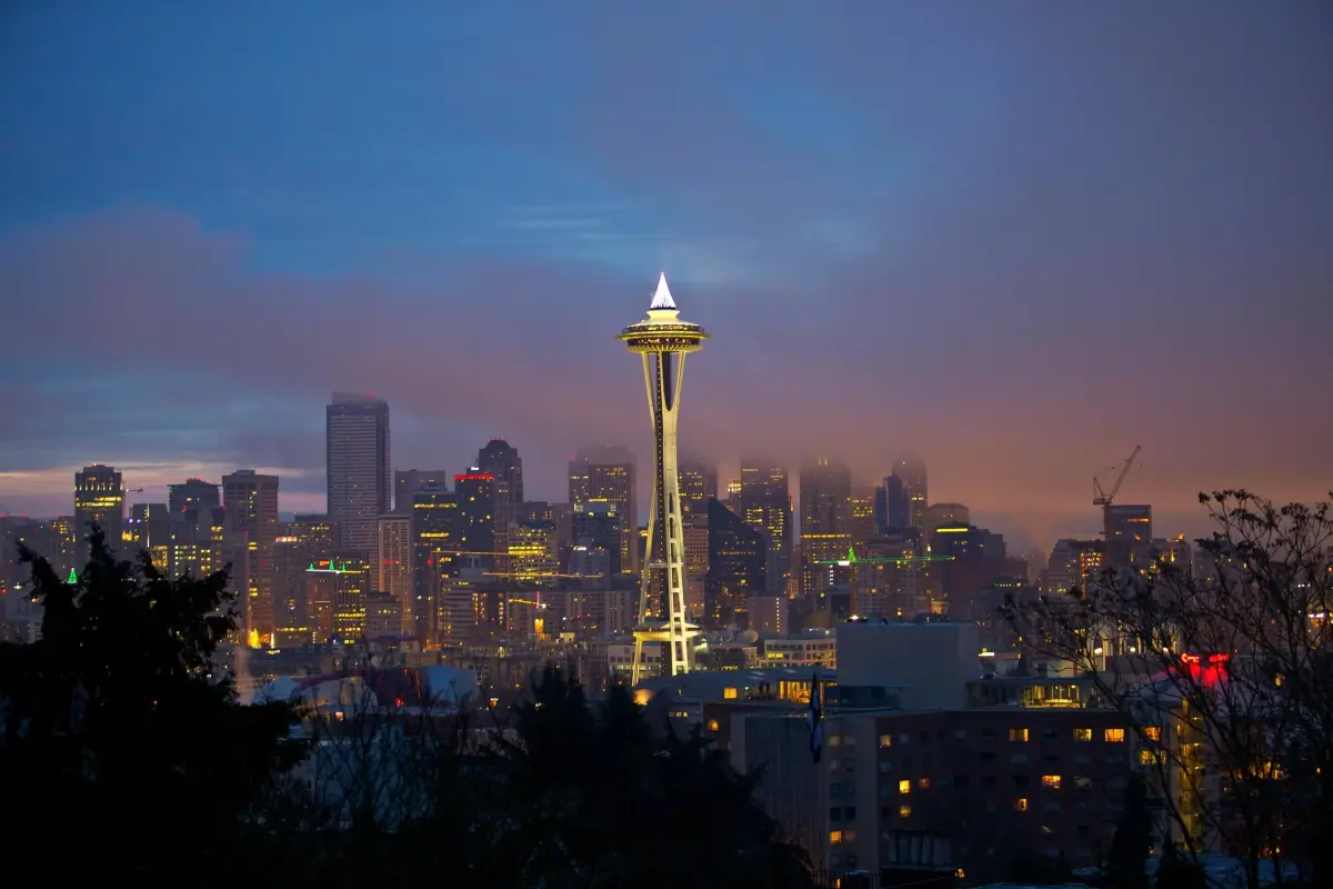 Seattle skyline at dusk with the iconic Space Needle glowing.